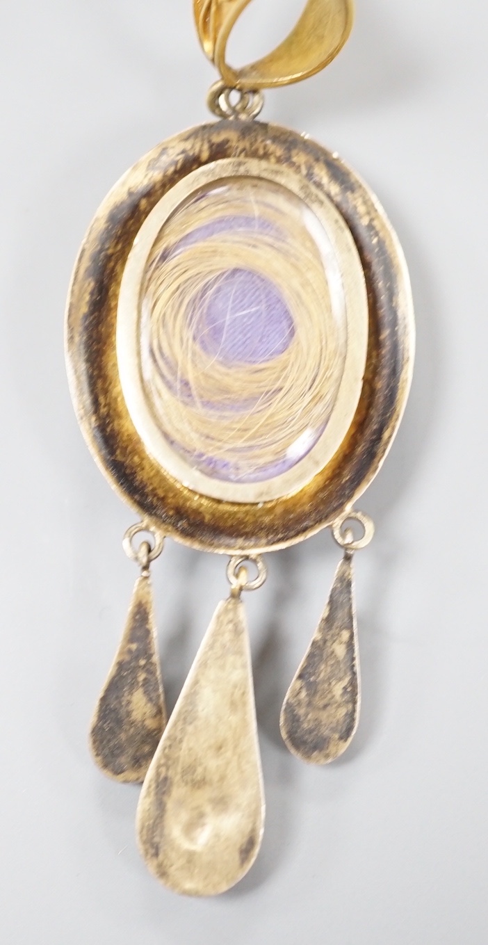 A Victorian yellow metal and micro mosaic set drop mourning pendant, depicting a dove with olive branch, with glazed back, overall 7cm, gross weight 10 grams (a.f.).